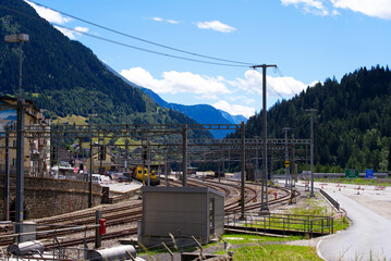 Railway station Airolo, Canton Ticino, with railway tracks and platform on a sunny summer day. Photo taken June 25th, 2022, Airolo, Switzerland.