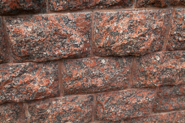 Red granite natural stone wall....