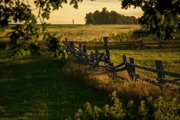 RURAL LANDSCAPE - Meadows and pastures are fenced with an old wooden fence