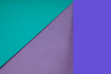 Textured and plain green blue purple pink sheet papers forming two triangles and vertical blank rectangle for creative cover designing