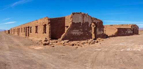 Ruins of abandoned buildings and houses in a mining ghost town from the nitrate era in the Atacama...