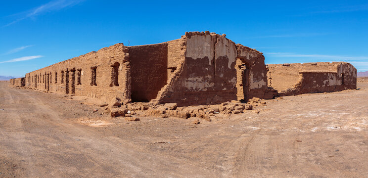 Ruins of abandoned buildings and houses in a mining ghost town from the nitrate era in the Atacama desert in the north of Chile
