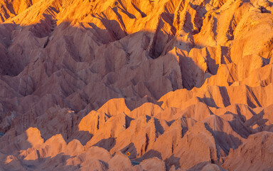 Sunrise over the strongly eroded badlands in the atacama desert in the vicinity of San Pedro de...