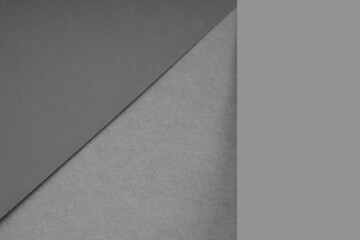 Textured and plain grey sheet papers forming two triangles and vertical blank rectangle for creative cover designing