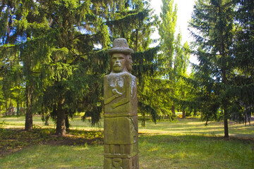 Reconstruction of Zbruch's idol - pagan pillar-statue in Open-air Museum of Folk Architecture and...