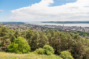 Fototapeta na wymiar Dundee, Scotland, UK – June 23 2022. Dundee city and the Firth of the Tay captured from above on Law Hill
