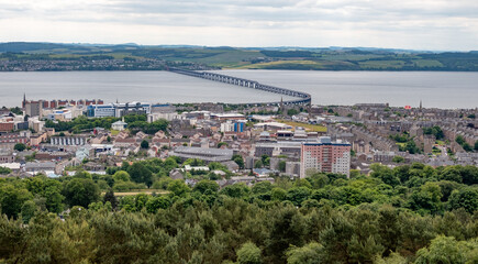 Dundee, Scotland, UK – June 23 2022. Dundee city and the Firth of the Tay captured from above on Law Hill
