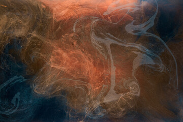 Liquid fluid art abstract background. Orange blue acrylic paint underwater, galactic smoke ocean