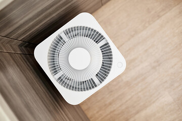 White air purifier in the kitchen of the apartment. Close-up, selective focus