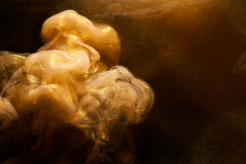 Liquid fluid art abstract background. Ocher jets and smoke rings dancing acrylic paints underwater, space ocean, color explosion © amixstudio