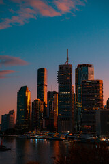 Fototapeta premium Brisbane city backlit by evening sunset
