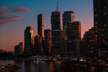 Fototapeta na wymiar Brisbane city backlit by evening sunset