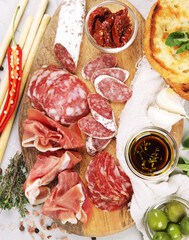 Sausages assortment on light background.