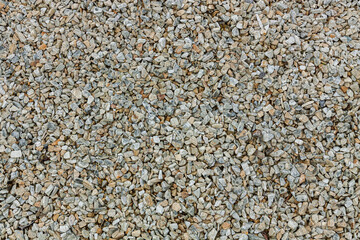 Gravel background, small granite stone. Construction material for building walls and fences.