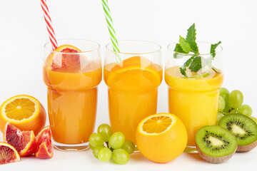 Fruit juices assortment on light background.