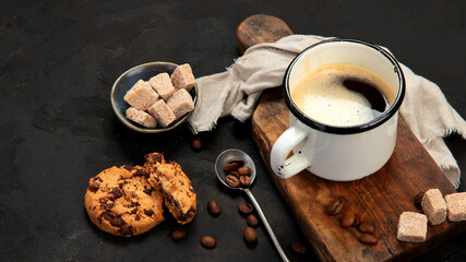 Cup of black coffee on dark background.