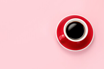 Coffee in red cup on color background.