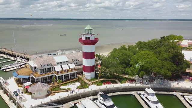 A wide drone shot of the lighthouse at Harbor Town on Hilton head island, sc