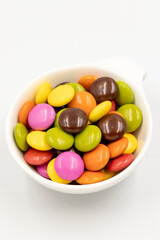 Colorful candies bonbon. Chocolate filled candy isolated on a white background. close up
