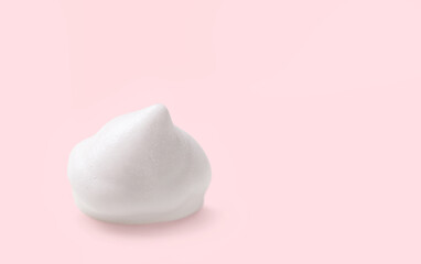 White cosmetic foam mousse, cleanser, shaving foam, washing product, shampoo on pink background.