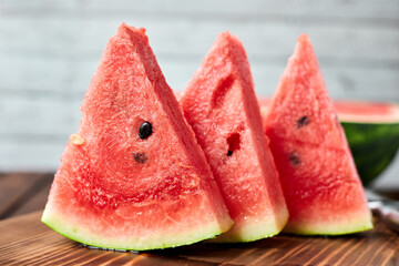 Sliced watermelon on wooden background. Close-up, selective focus