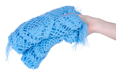 A blue scarf cape is crocheted handmade in hand on white background isolation