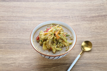 Rujak Serut, Indonesian fruit salad made from grated variety of fresh fruits and mixed with a sauce made of brown sugar, chili, salt and peanuts.
