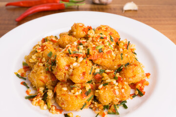 Fried prawns with flour, stir-fried with chili, pepper, salt. One of the popular Chinese food in Indonesia