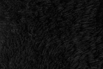 Faux fur black wool abstract pattern nature skin soft warm fluffy background dark artifical texture