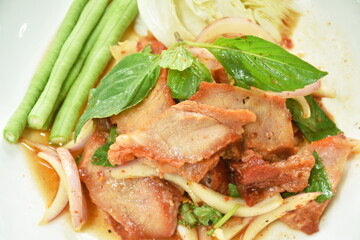 Thai spicy slice barbecue pork neck salad eat couple fresh cabbage and yard long bean on plate with sticky rice 