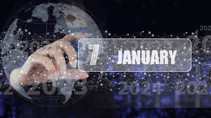 January 7th. Day 7 of month, Calendar date. Hand hold virtual screen card with calendar date. Winter month, day of the year concept.