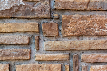 Wall composed of rectangular segments of stone