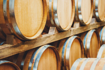 Wine barrels stacked in the cellar.