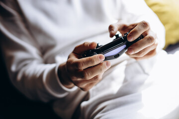 Man playing video games using joystick