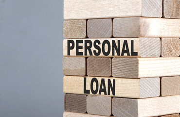 The text on the wooden blocks PERSONAL LOAN
