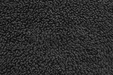 Faux fur black wool abstract pattern nature skin soft warm fluffy background dark artifical texture
