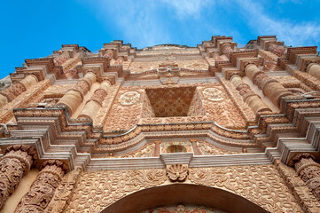 Facade detail at Santo Domingo Church, a Dominican Convent in San Cristobal de las Casas, Mexico. The monastery is one of the most ornate in Latin America, due to the stucco work on the main facade.