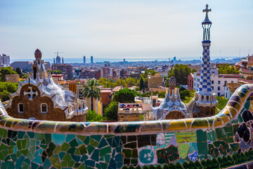 Park Guell by architect Antoni Gaudi in Barcelona, Spain. Incredible mosaic in Park Guell - obrazy, fototapety, plakaty
