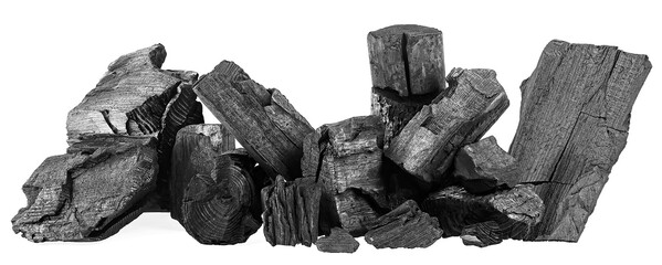 Pile of natural hardwood charcoal isolated on a white background