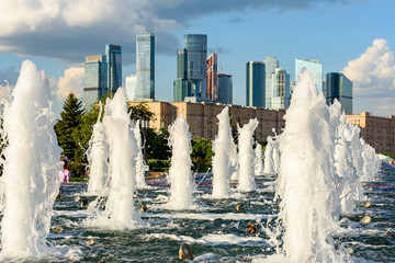 Fountains in Victory park on Poklonnaya hill with Moscow city at background, Russia.