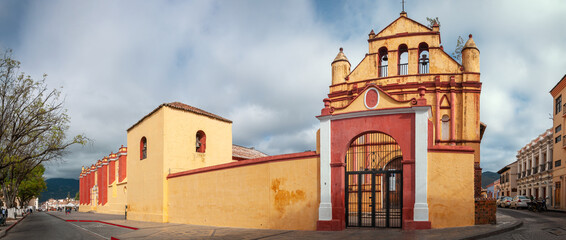 San Cristóbal Cathedral Panorama, Central Park, San Cristobal de las Casas, Mexico. The Cathedral is the symbol of the City's colonial architecture. It's facade colorful facade has Baroque influences.
