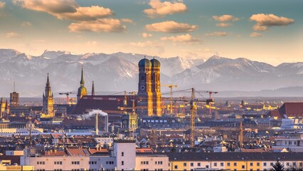 Munich skyline aerial view from sky marienplatz old town frauenkirche cathedral alps mountains.