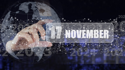 Fototapeta na wymiar November 17th. Day 17 of month, Calendar date. Hand hold virtual screen card with calendar date. Autumn month, day of the year concept.