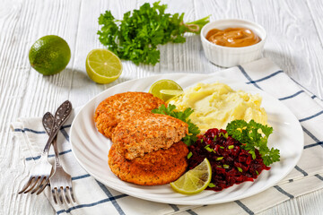 salmon patty with potato mash and beetroot salad