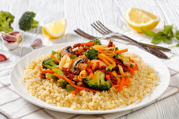 quinoa with fried veggies, mushrooms on plate