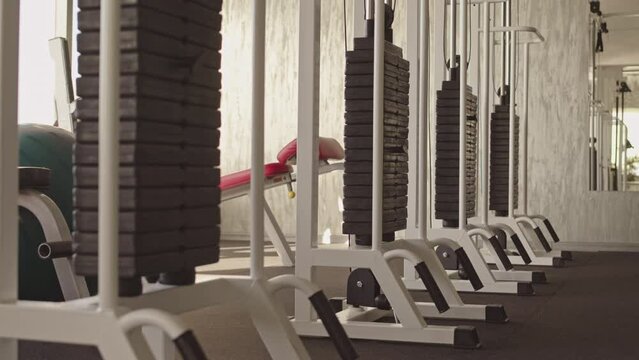 No People Overview Of Pulldown Machines In Row In Modern Gym Or Fitness Center