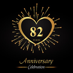 82 years anniversary celebration with golden heart and fireworks isolated on black background. Premium design for weddings, birthday party, celebration events, banner, graduation, greetings card.
