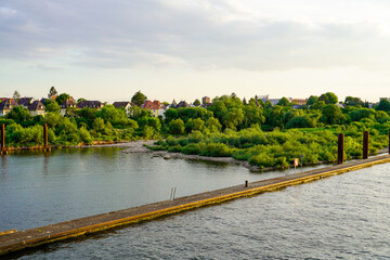 View of the Neckar and Heidelberg from the Wehrsteg Wieblingen. Weir on the Neckar. Pedestrian and...