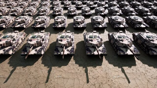 An aerial view over hundreds of military armored tanks ready to be moved to the front line of the war.