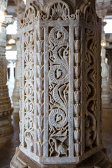 Marble column carved with a beautiful bird and flower pattern in the Jain temple Adinatha temple in Ranakpur, Rajasthan, India, Asia 